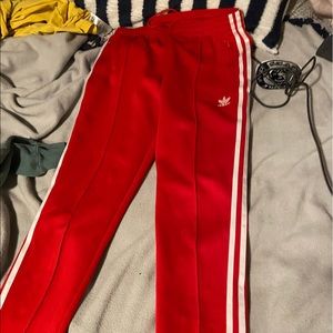red adidas track pants
